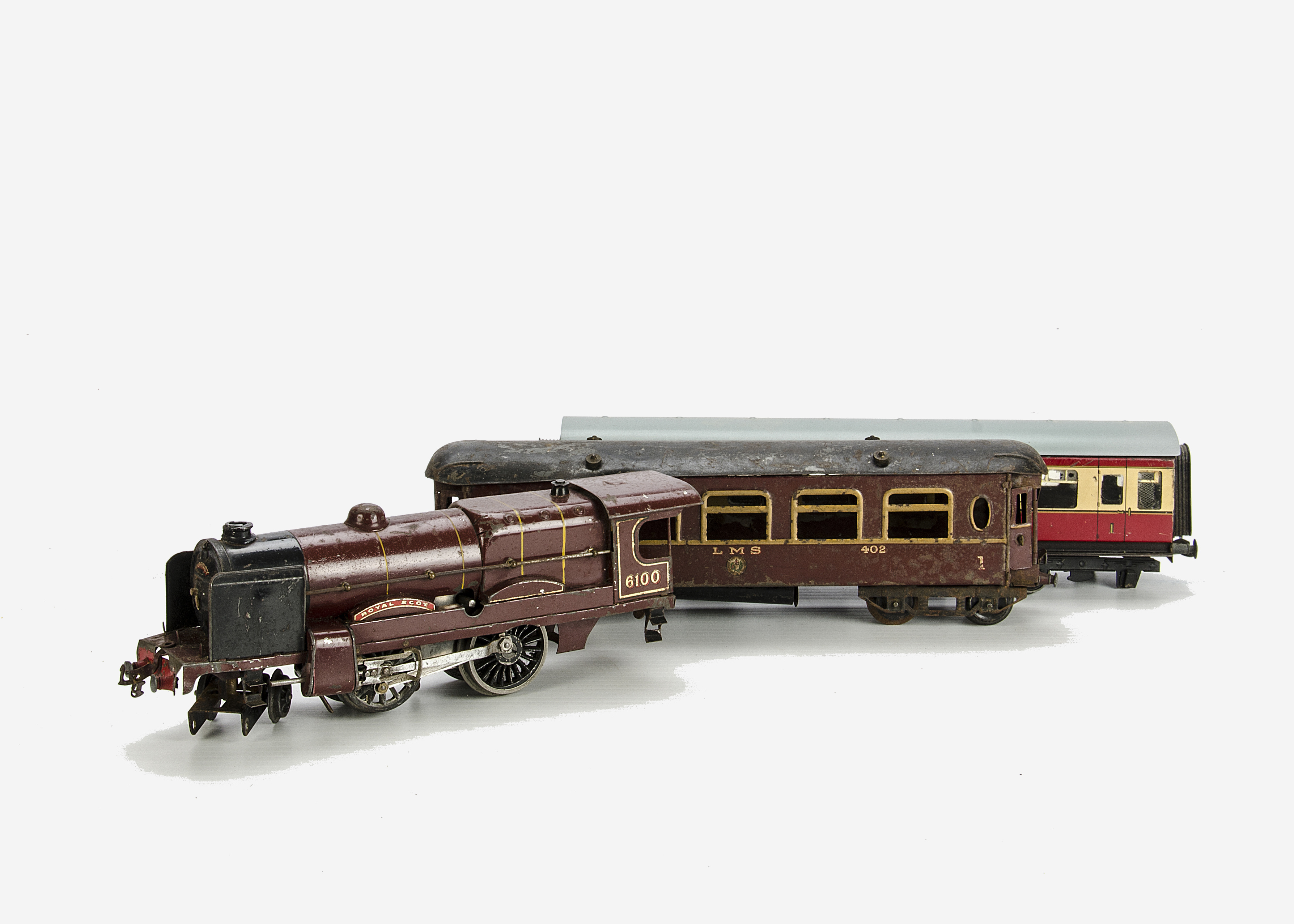 Hornby O Gauge No 3 Clockwork Royal Scot Locomotive Coach and Bassett-Lowke Coach, comprising LMS