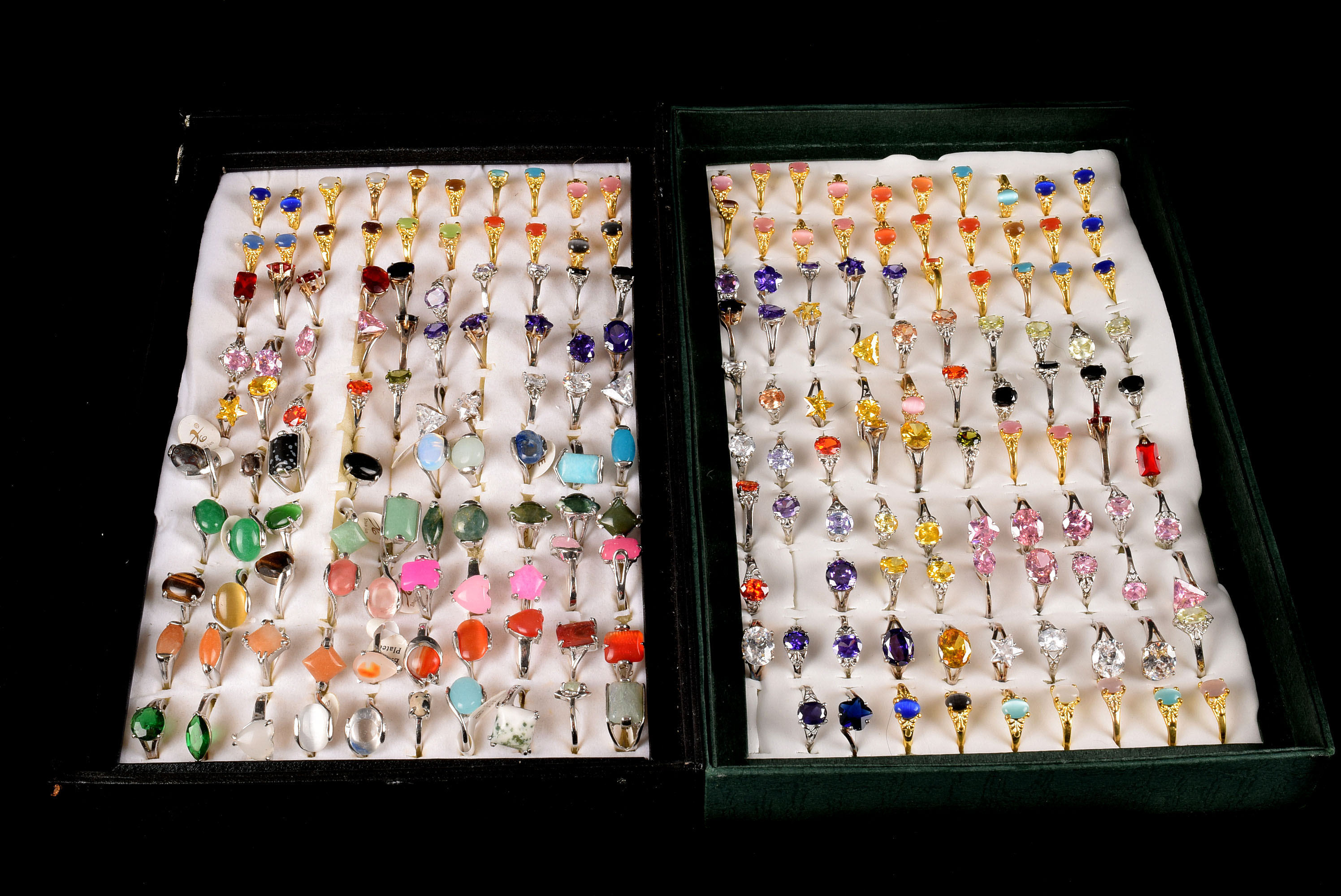 A large collection of modern fashion rings, in two trays, each set with coloured stones, some marked