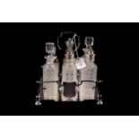 A 19th century silver plated cruet, with glass bottles, also a swing handled cake basket plated, and