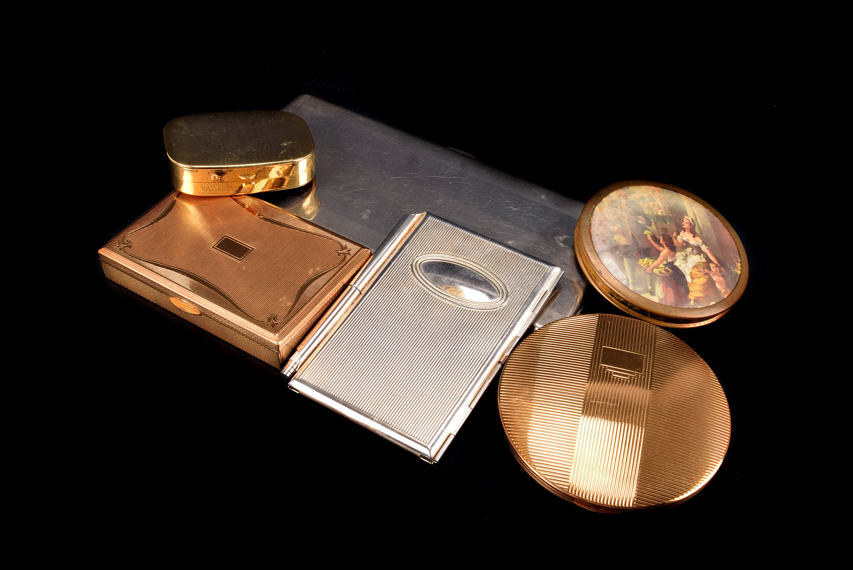 A group of four modern compacts, including two gilt examples by Melissa, two other, together with