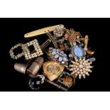 A collection of costume jewellery, including an agate set mourning brooch and a pair of agate