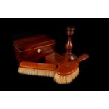 A Mahogany veneer Tea caddy, together with a pair of turned mahogany candlesticks with weighted