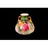 A Royal Worcester Rose vase, the twin handled vase having rose design, with gilt decoration to the