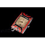 An Art Deco period lady's purse watch, the rectangular cushion case having red and black enamel