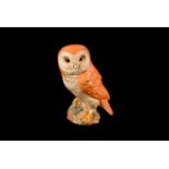 A porcelain Beswick owl figure, marked 1046 to base, approx. 19cm H