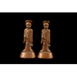 A pair of vintage Chinese brass figural weights, both modelled as men in robes on bases (2)
