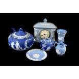 A collection of blue Wedgwood Jasperware, to include a clock, plates, vases, a tea pot and much more