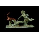 An Art Deco plaster figure group, modelled as Diana with her hounds chasing a deer, approx 32cm L