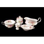 A Comprehensive Royal Albert Service, in the Moss Rose pattern, comprising of serving, dinner & side