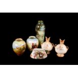 An assortment of Royal Doulton ceramic items, including a pair of Burslem vases, a vase with horse