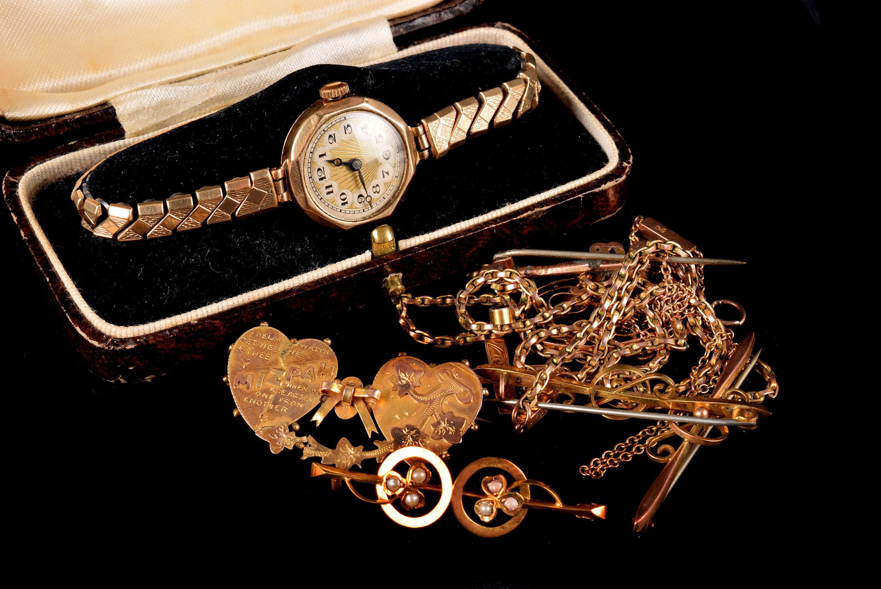 Seven 9ct gold items of jewellery and a 9ct gold cased lady's wristwatch, including an Edwardian