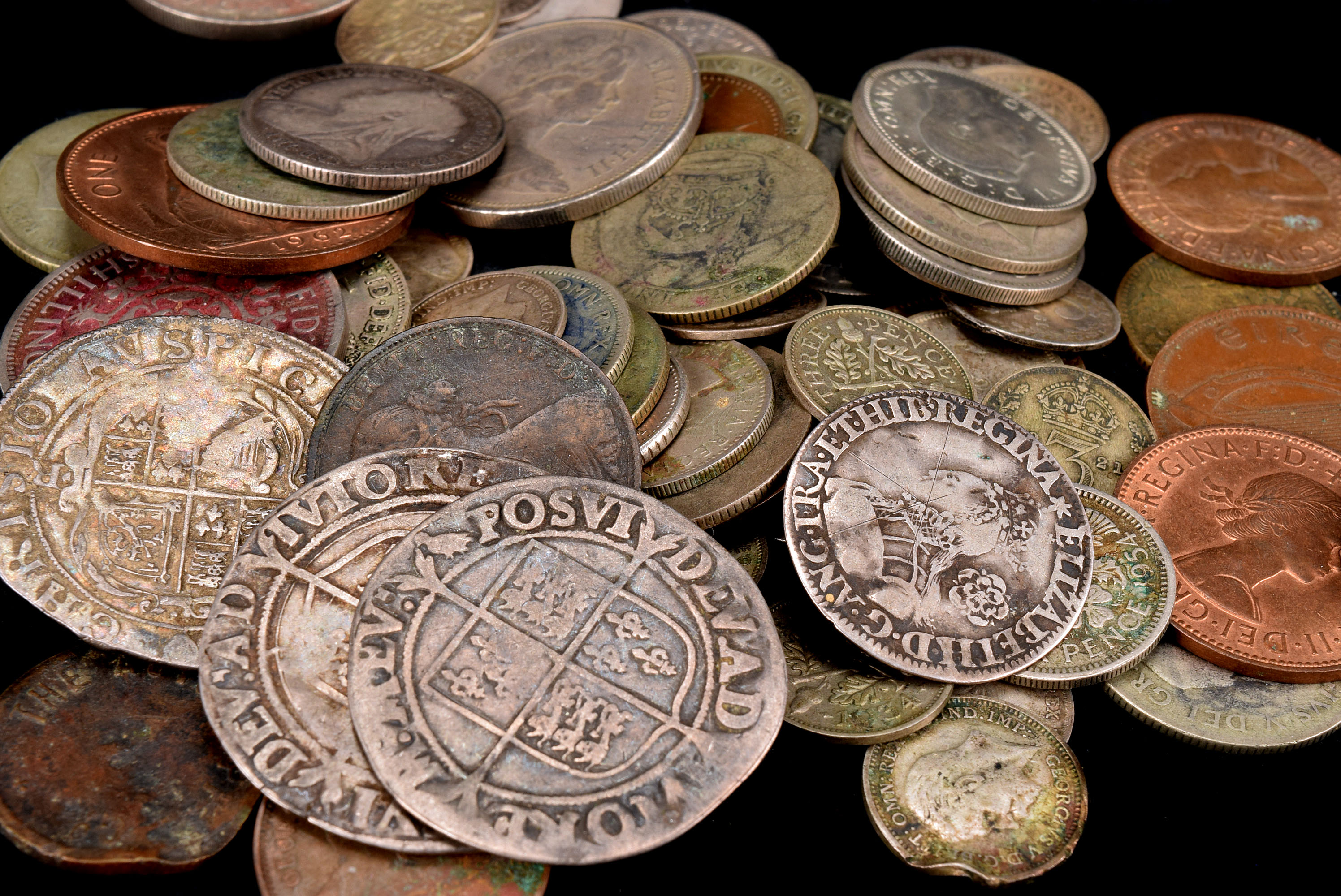 Three Elizabethan coins and a Charles I coin, including two Elizabeth I shillings, worn, and a groat