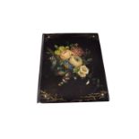 A 19th century black lacquered folio, painted with a spray of flowers, with mother of pearl