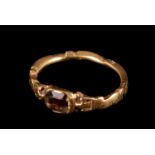 An 18th century gold mourning ring, having clear stone panel tablet, the band with rubbed and