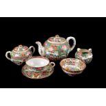 A Hong Kong eggshell porcelain tea set, in famille rose style design, comprising plates, cups and