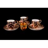 Royal Crown Derby tea ware, comprising three saucers, and four cups, plus a Royal Worcester fruit