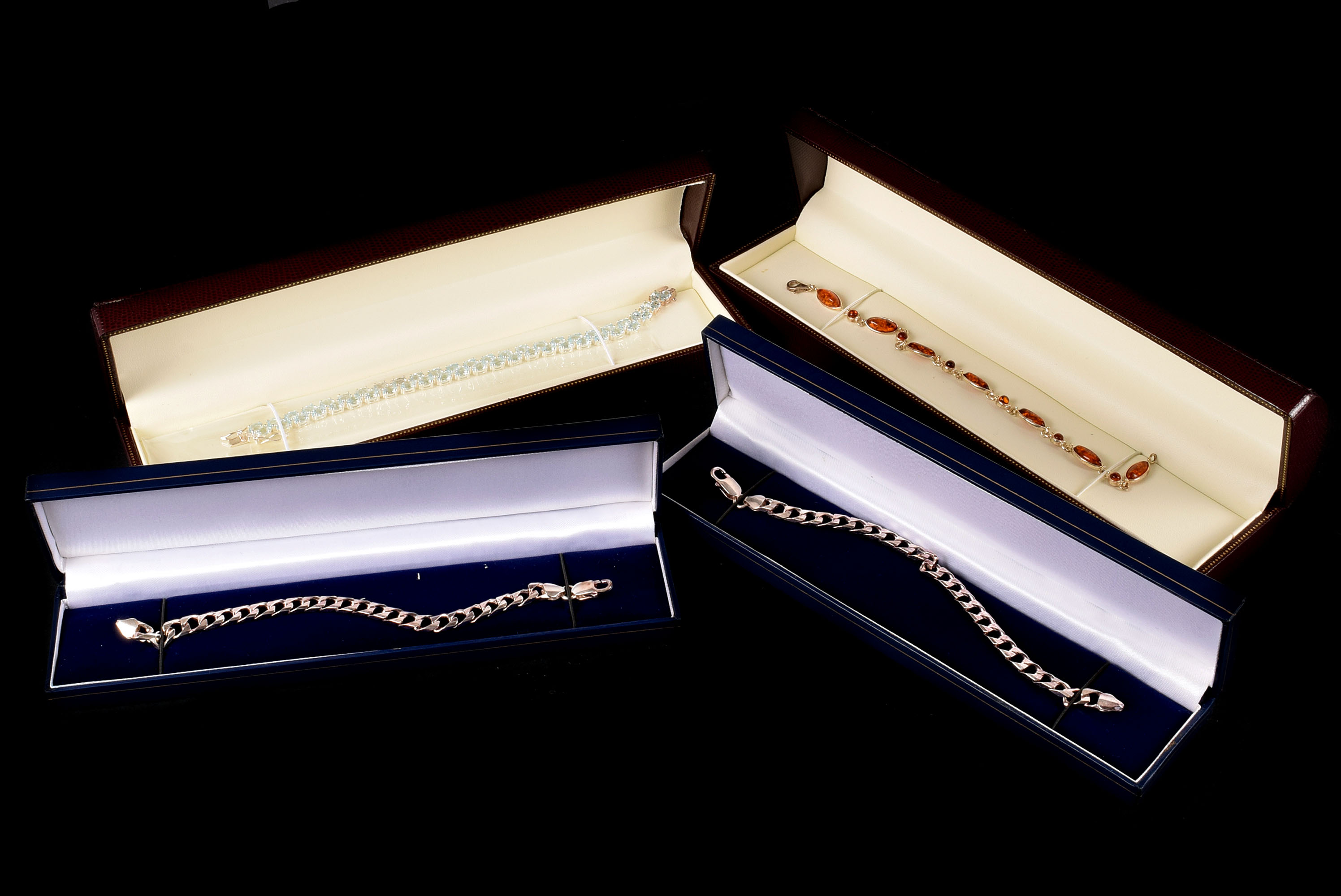 Four modern silver bracelets, all boxed, including two flattened link examples, one set with amber