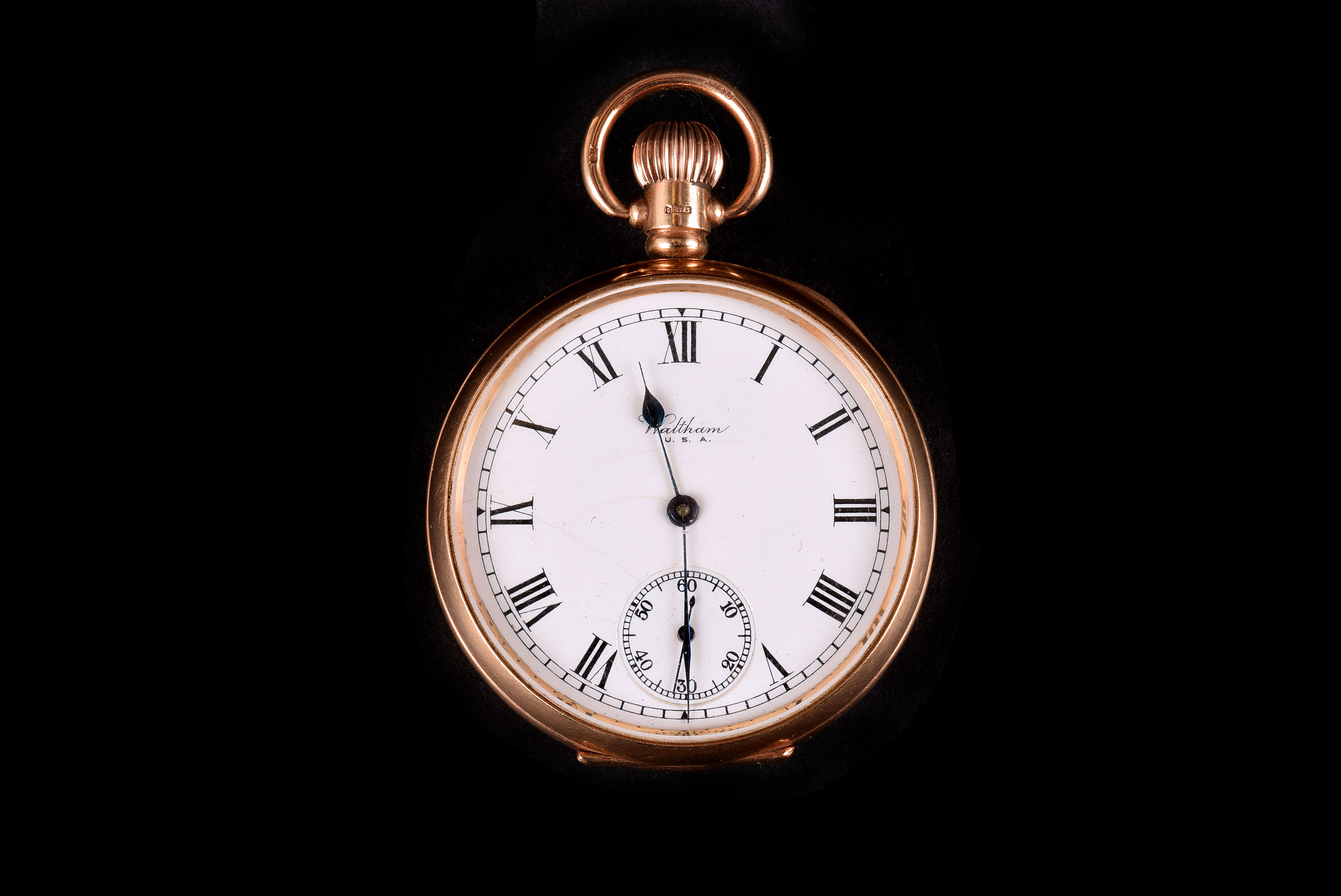 A George V period 9ct gold Waltham open faced pocket watch, hallmarked to stem, rear and dust