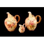 A pair of Royal Worcester Blush Ivory ewers, both marked 1094 to base, one in red the other in