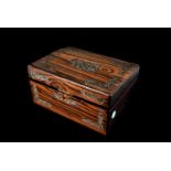 An inlaid rosewood sewing box, having inlaid mother of pearl floral decoration, opens to reveal