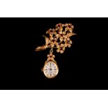 A 9ct gold and garnet Rotary lady's fob or nurse lapel watch, hallmarked to the oval case, with a