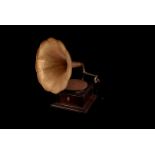 A 20th century foreign made gramophone, having stained beech base with brass embossed horn