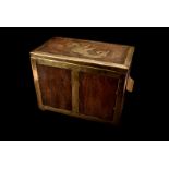 A 20th century oak and brass bound casket, of rectangular shape, the hinged top decorated with