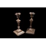 A pair of Victorian silver filled candlesticks from William Hutton & Sons, in the neoclassical