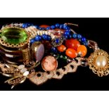 A collection of costume jewellery, including a paste set suite in a case, brooches, necklaces and