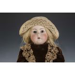 A Simon & Halbig for Kämmer & Reinhardt 403 child doll, with brown lashed sleeping eyes, pierced