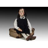 Sally Anne, a ventriloquist school girl dummy, with papier-mâché head, mechanism for moving eyes and