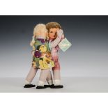 A Dean’s Rag Book Bunty and Bobby Dancing Dolls, with printed faces, mohair wigs, original