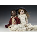 Dolls and doll’s clothes: an AM 370 on kid body (damaged forehead); a black composition AM baby; and