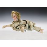 A rare Roullet & Decamps clockwork Ondine swimming doll, with Simon & Halbig bisque head, blue glass