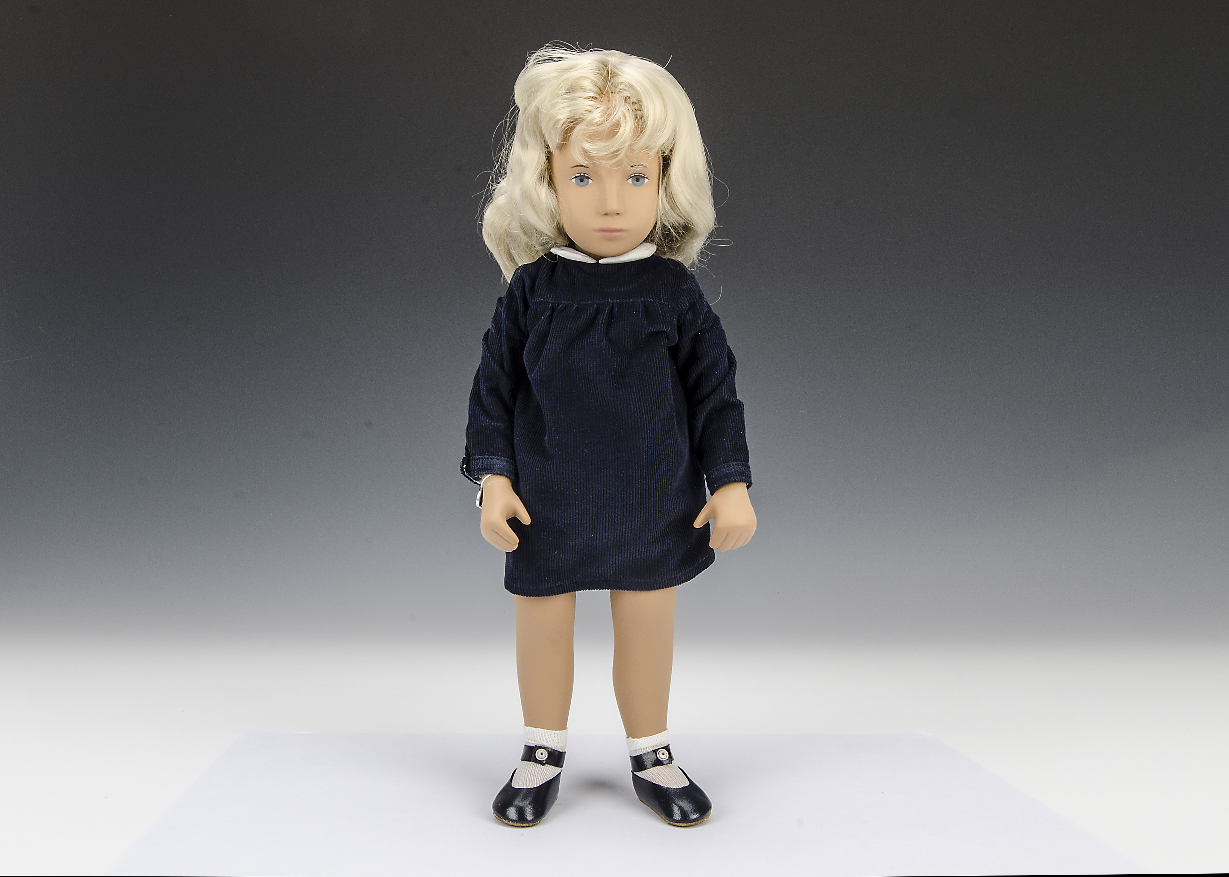 A Trendon Sasha No.1 Sasha 1965-1985, with long blonde hair, navy corduroy dress, white socks and