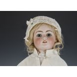 A Simon & Halbig DEP 1079 child doll, with blue sleeping eyes, pierced ears, original blonde