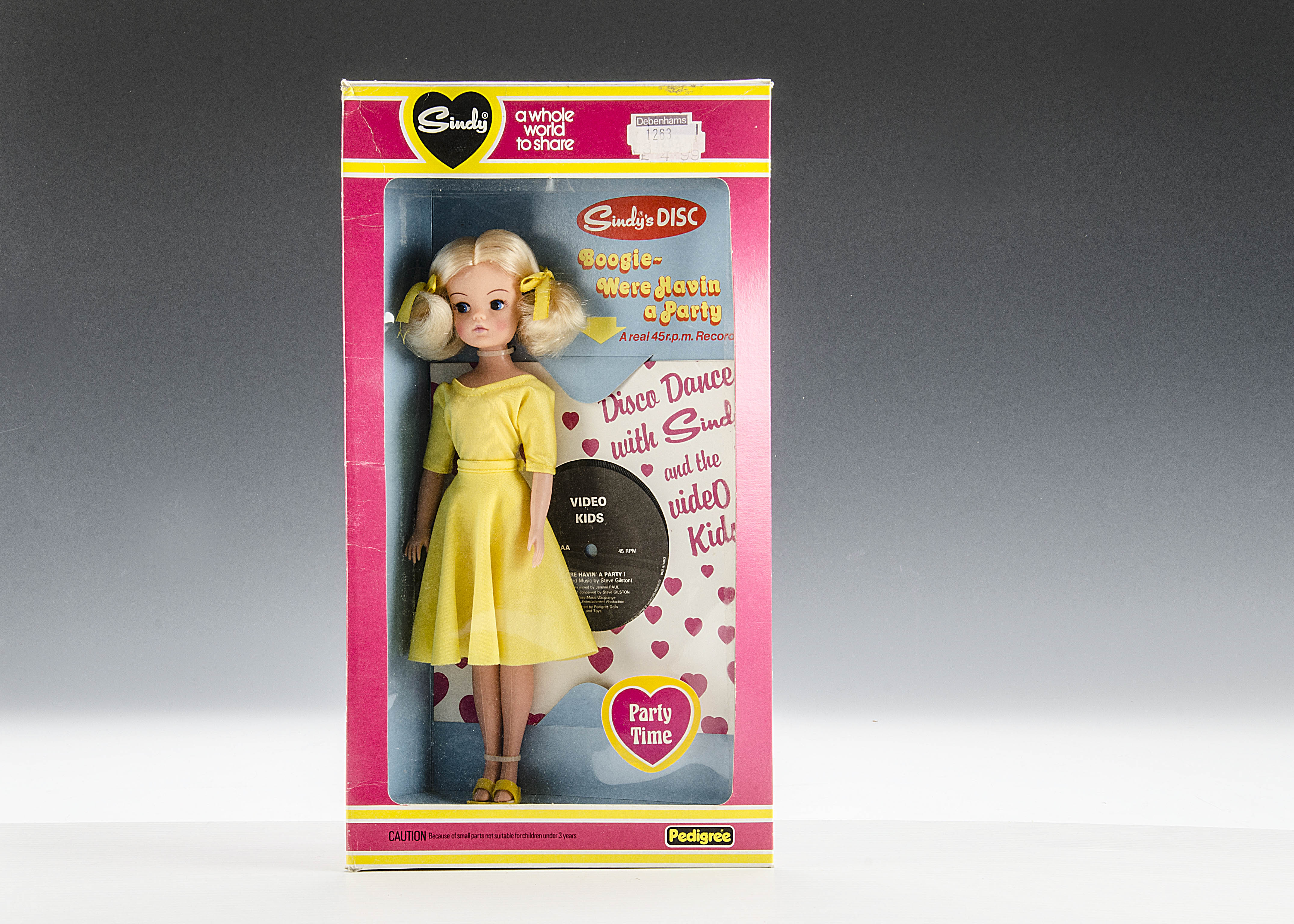 A Pedigree Party Time Sindy No.44743, 1981, with blonde hair and yellow dress, in original pink