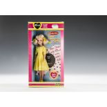 A Pedigree Party Time Sindy No.44743, 1981, with blonde hair and yellow dress, in original pink