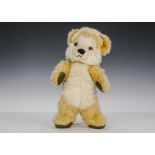 A rare Merrythought ‘1950s Teddy Bear’, with golden wool plush and white mohair face and chest,