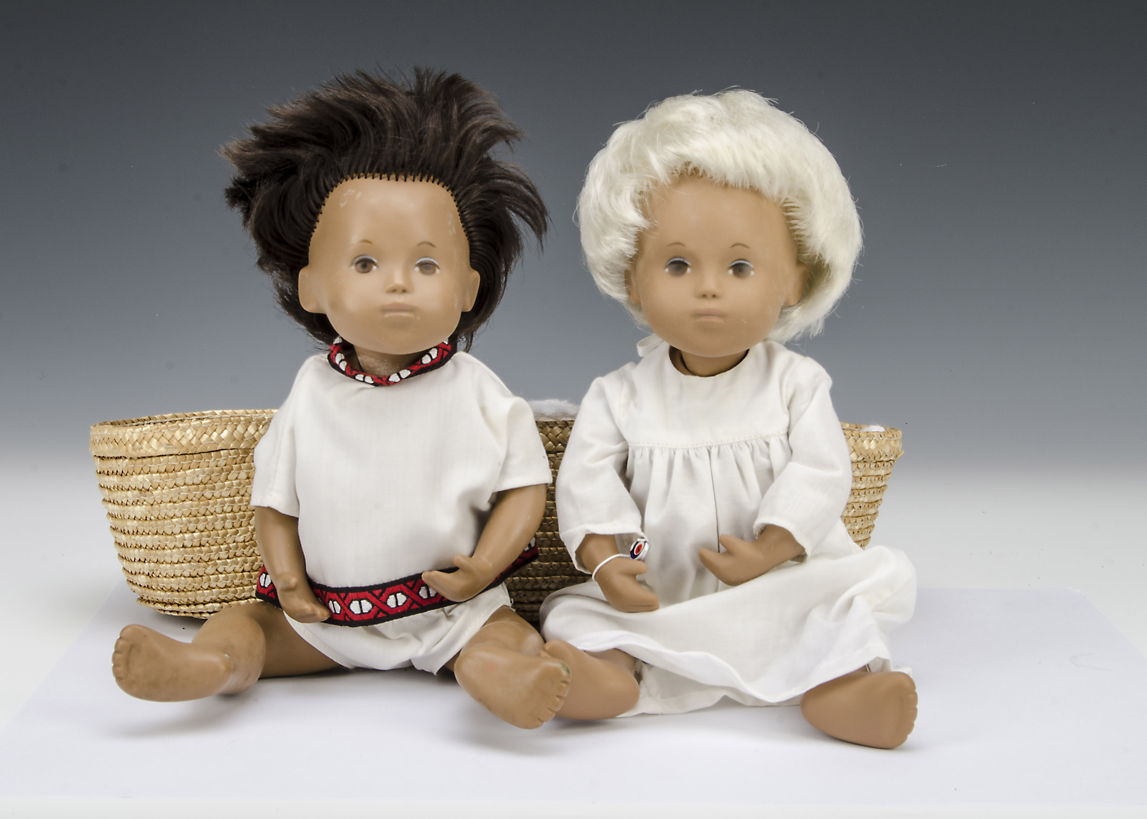 A Trendon Sasha baby Gregor, 503, with blonde hair, nightdress, wrist tag and Moses basket on