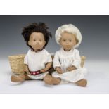 A Trendon Sasha baby Gregor, 503, with blonde hair, nightdress, wrist tag and Moses basket on