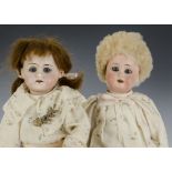 Two small bisque headed dolls: one Armand Marseille 390 with blue sleeping eyes and blonde sheepskin