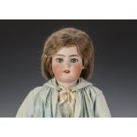 A Simon & Halbig 1078 child doll, with blue lashed sleeping eyes, textured brow, pierced ears,