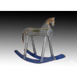 An early 20th century naïve Swedish wooden rocking horse, on straight legs with bow rocker,