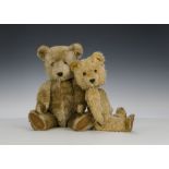 Two post-war Chiltern teddy bears: a blonde Hugmee with orange and black glass eyes, black