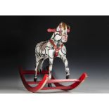 An eastern European painted hessian rocking horse 1950s, on straight legs with bow rocker, painted