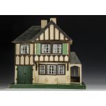 A Tri-ang dolls’ house late 1930s, half-timbered, cream painted with garage and porch and front door