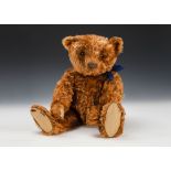 A rare early Steiff centre-seam cinnamon mohair teddy bear, circa 1908, with black boot button eyes,