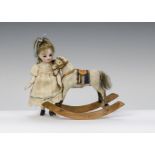 A German dolls’ house rocking horse, hide covered with leather tack on bow rocker - 41?4in. (10.
