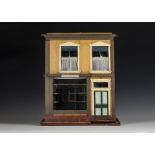 No.7 Elsie Mountjoy, a home built collapsable toy shop dolls’ house, with two storeys, the front